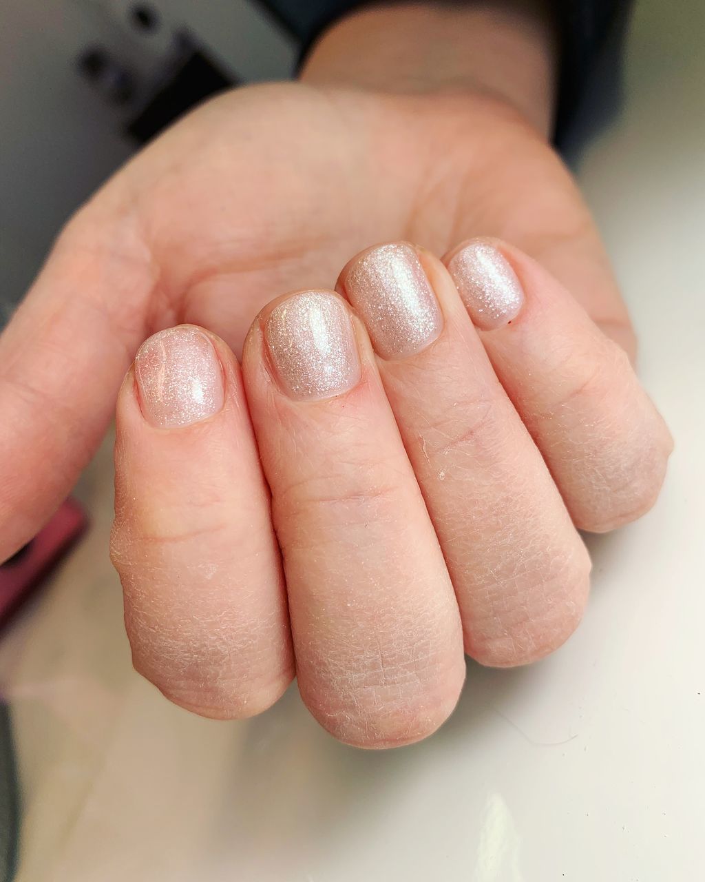 CLOSE-UP OF WOMAN HAND WITH BABY