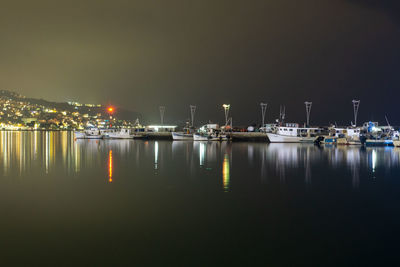 Sailboats in marina at night