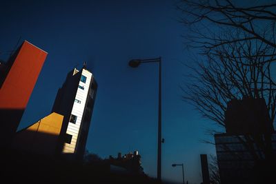 Low angle view of road sign against clear sky