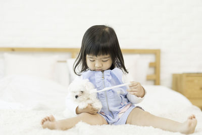 Cute girl holding toy