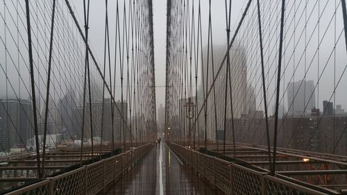 View of suspension bridge in foggy weather