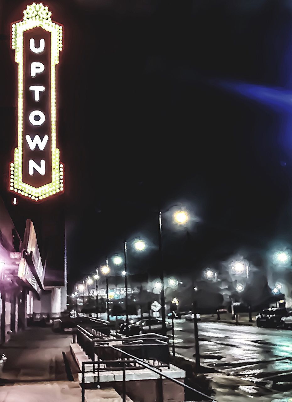 ILLUMINATED STREET LIGHTS AT NIGHT