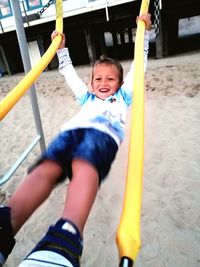 Happy boy playing in playground