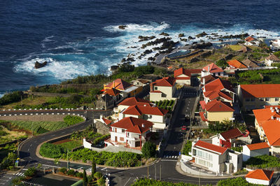 Built structures against calm blue sea