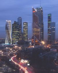 Aerial view of city lit up at night