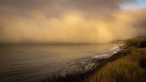 Scenic view of sea against sky during sunset