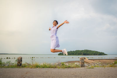 Smiling young nurse on field