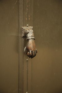 Close-up of knocker on door