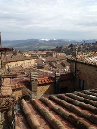High angle view of buildings in city against sky