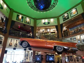 Low angle view of illuminated lanterns hanging in shopping mall