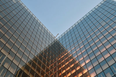Low angle view of modern building against clear sky