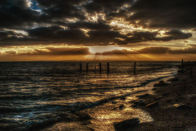 Scenic view of sea against sky at sunset