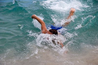 High angle view of man swimming in sea