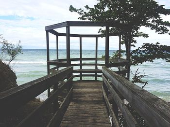 Pier on sea against sky