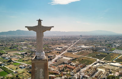 Aerial view of city buildings against sky