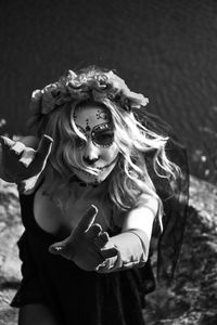 Closeup portrait of calavera catrina. black and white photo. young woman with sugar skull makeup.