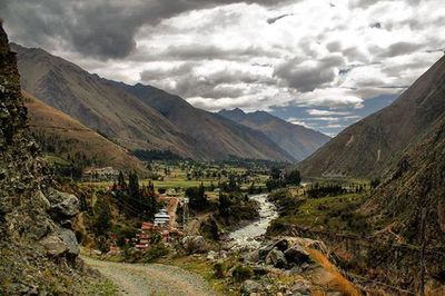 Scenic view of mountains against cloudy sky