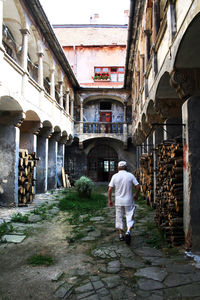 Rear view of man walking on street