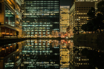 Illuminated buildings in city at night