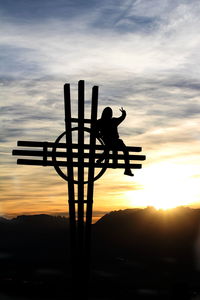 Silhouette of people at sunset