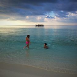 Scenic view of sea against cloudy sky
