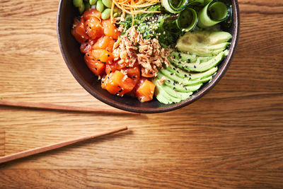 High angle view of chopped vegetables in bowl on table