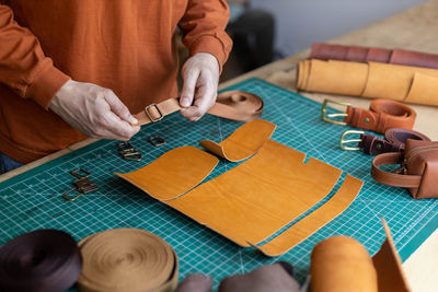 Midsection of craft person working at workshop