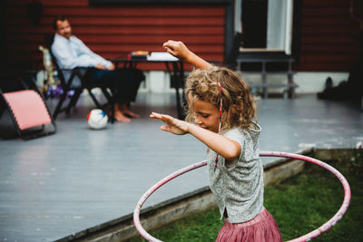 Side view of girl playing in water