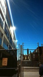 View of buildings against clear blue sky