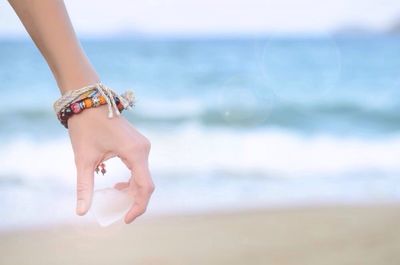 Woman standing on beach
