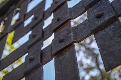 Medieval, forged metal gate grille, against the sky