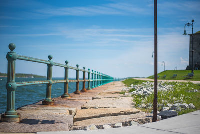 Street by sea against sky