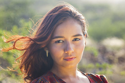 Portrait of beautiful young woman outdoors