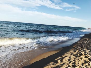 Scenic view of beach against sky