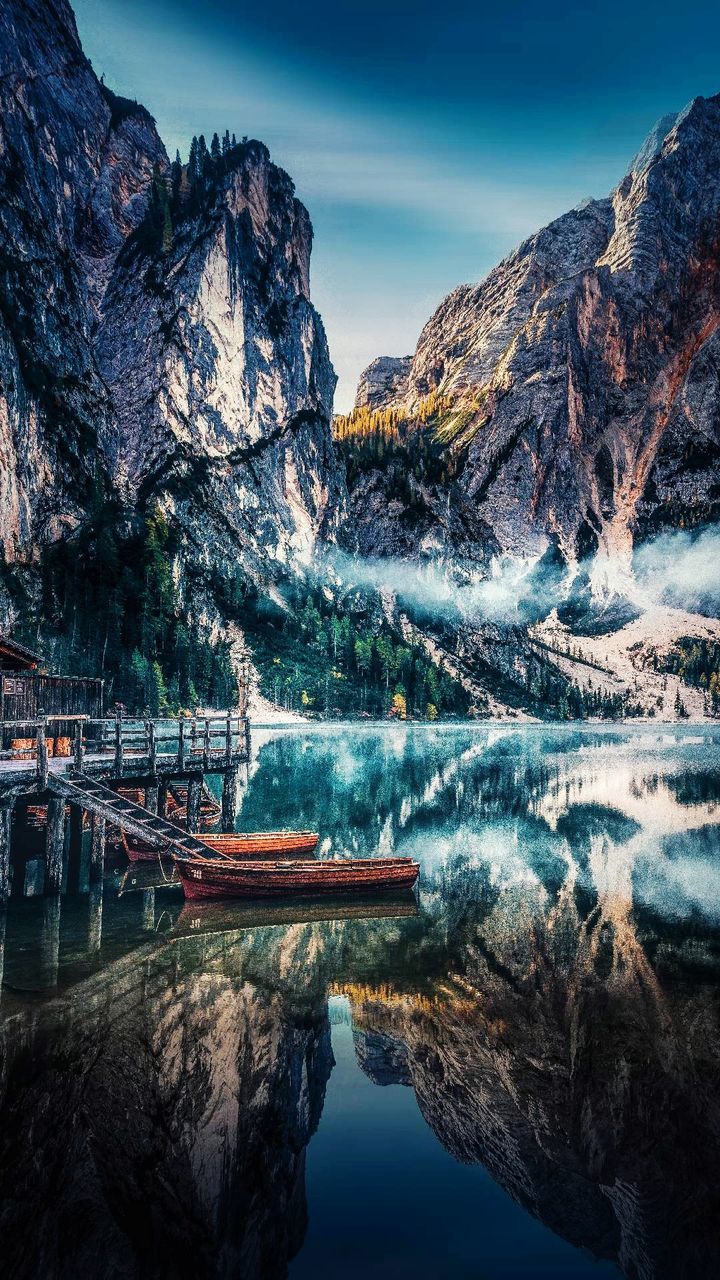 water, mountain, beauty in nature, scenics - nature, rock, reflection, rock - object, solid, sky, nature, tranquil scene, lake, tranquility, travel destinations, mountain range, non-urban scene, rock formation, waterfront, day, no people, outdoors