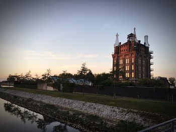 Clock tower against sky at sunset