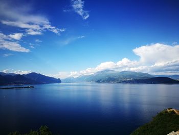 Scenic view of lake against blue sky