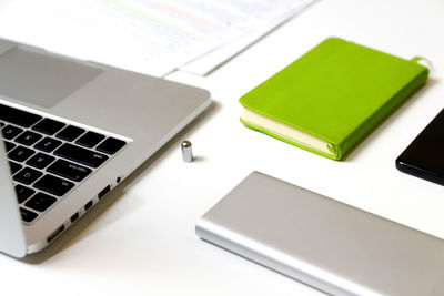 High angle view of laptop and mobile phone on table