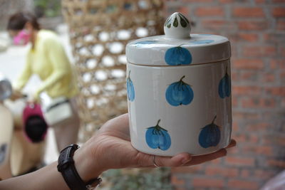 Close-up of hand holding drink