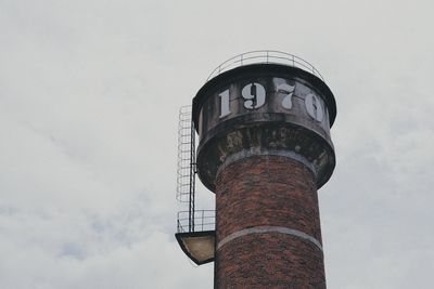 Low angle view of water tower against sky