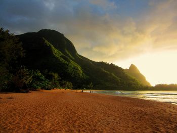 Scenic view of beach against sky during sunset