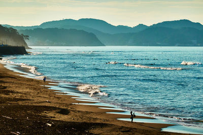 Scenic view of beach against sky on the morning