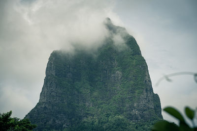 Low angle view of rock formation against sky