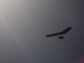 Airplane flying against clear sky