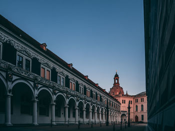 Low angle view of historical building against blue sky