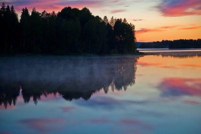 Scenic view of lake at sunset