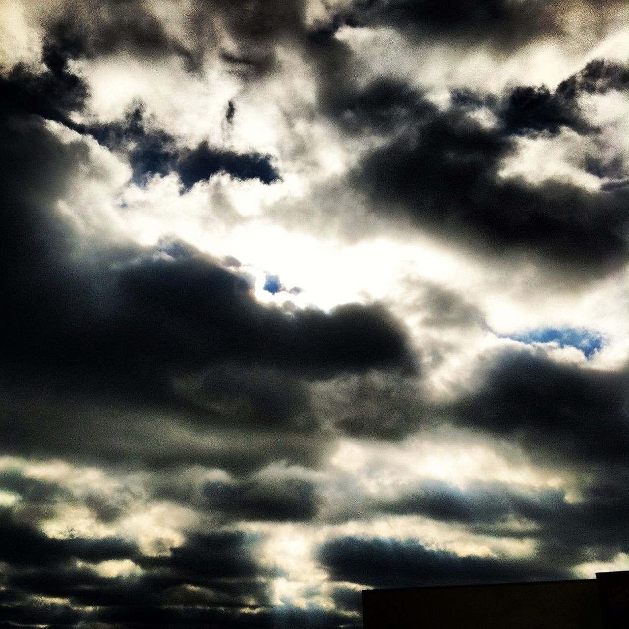 sky, low angle view, cloud - sky, cloudy, cloud, cloudscape, weather, beauty in nature, nature, overcast, silhouette, scenics, tranquility, dramatic sky, high section, outdoors, no people, built structure, storm cloud, sunset