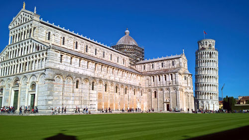 Low angle view of historical building against blue sky