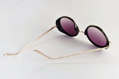 Close-up of sunglasses against white background