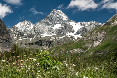 Scenic view of snowcapped mountains against sky